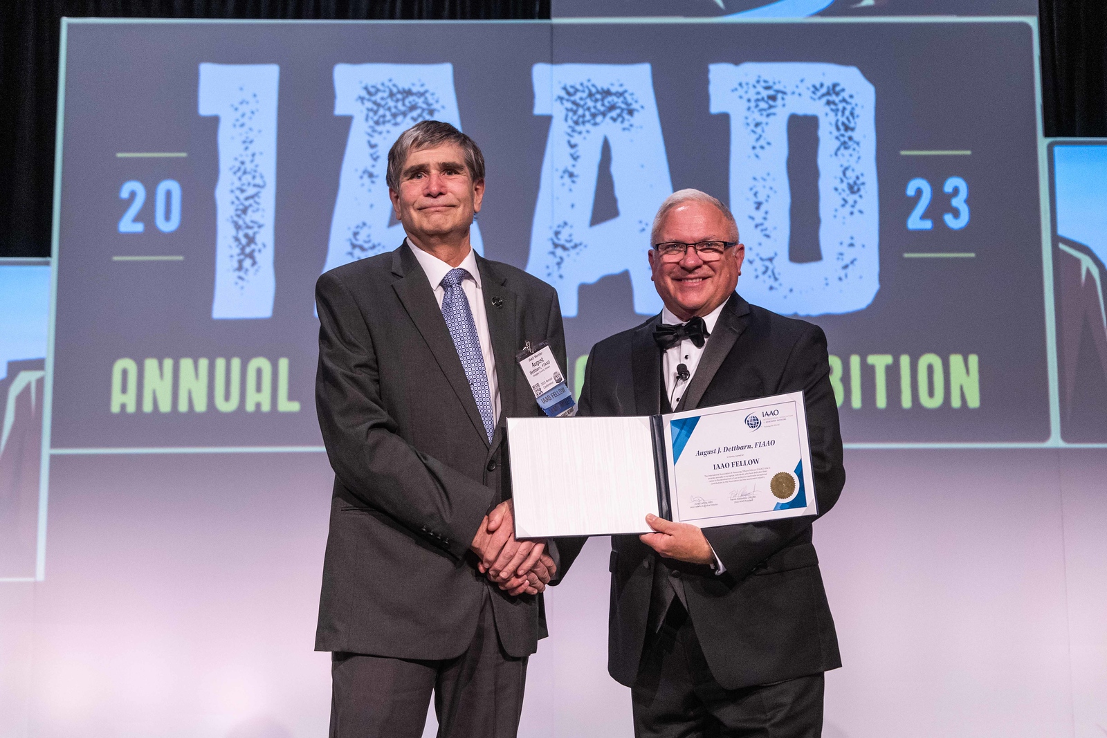 Appraisal Analyst August Dettbarn, left, receives a Fellows award from the International Association of Assessing Officers. He is pictured with IAAO president Patrick Alesandrini on Aug. 30, 2023, at the annual conference in Salt Lake City.