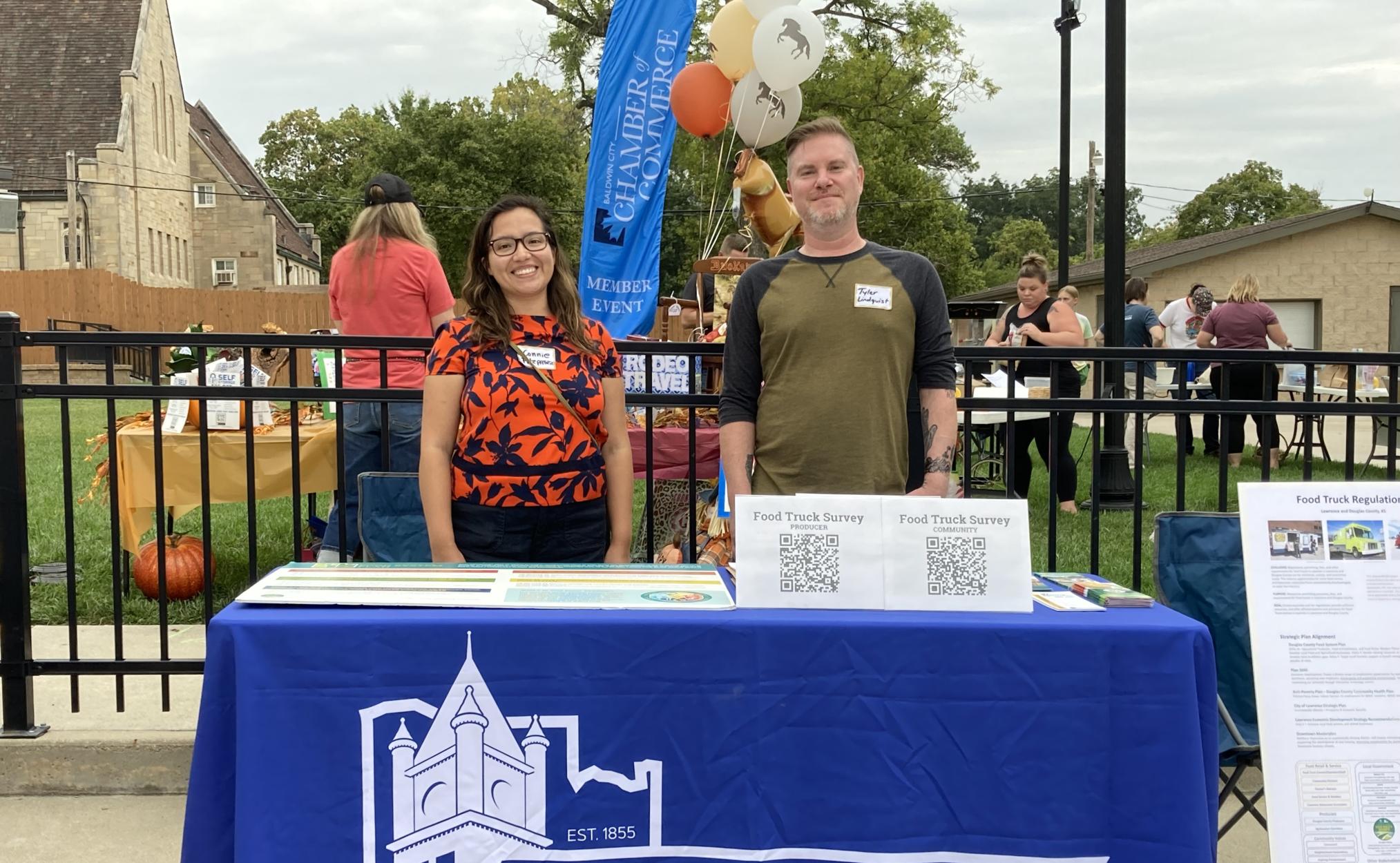 Douglas County Food Systems specialist Connie Fiorella Fitzpatrick, left, and Douglas County Food Policy Council member Tyler Lindquist attended the Third Friday Market on Sept. 15, 2023, in Baldwin City.