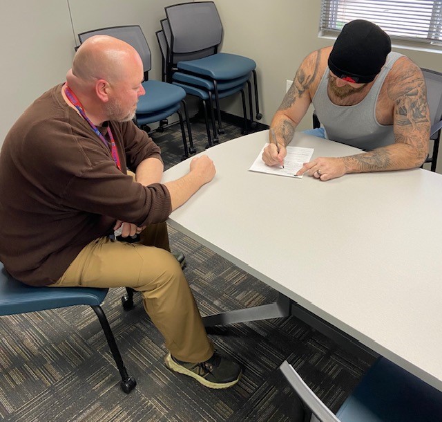 Client sitting in pretrial meeting