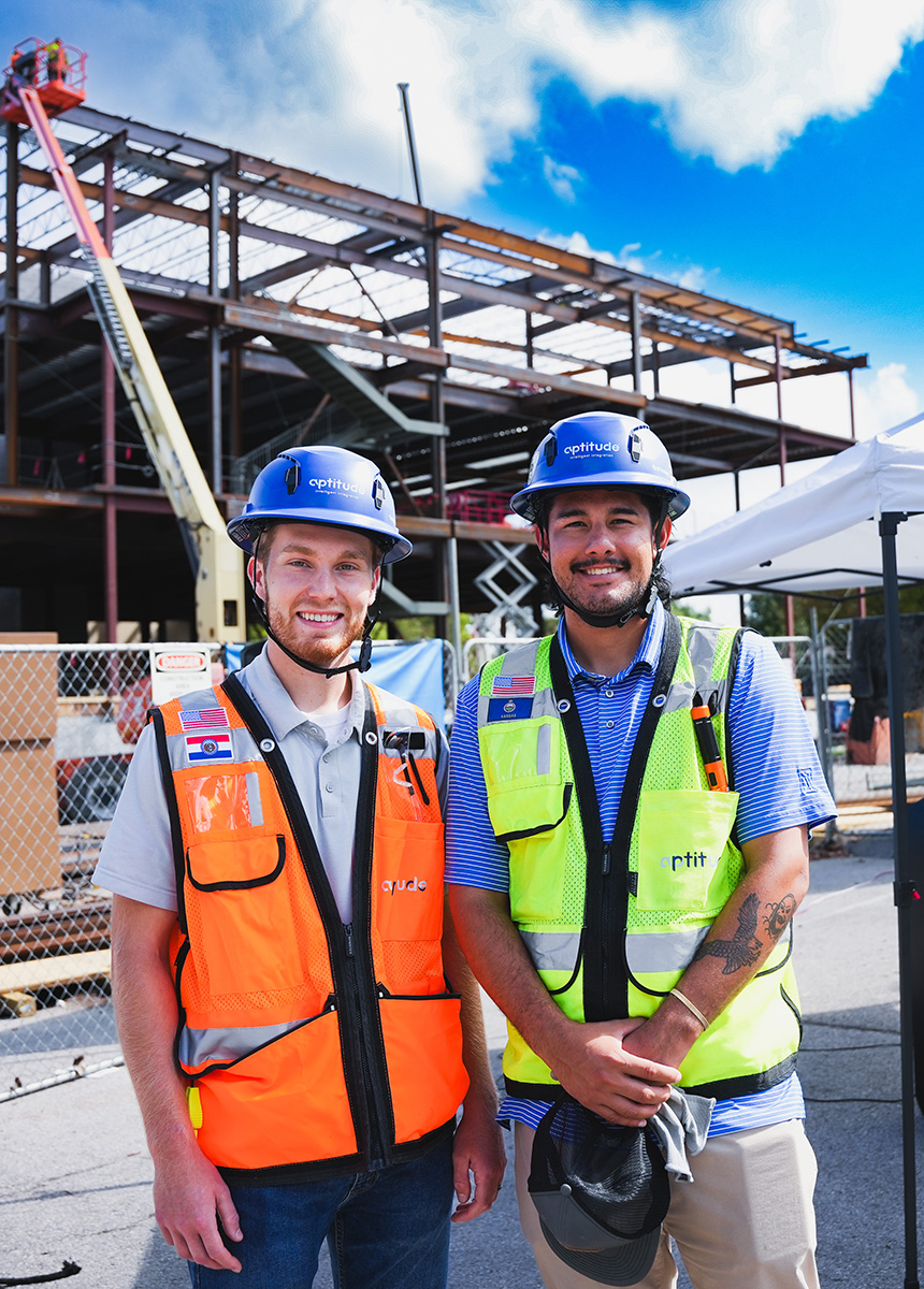 Workers posing for photo in front of JLEC