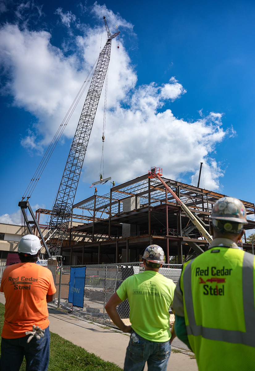 Workers onlooking beam placement