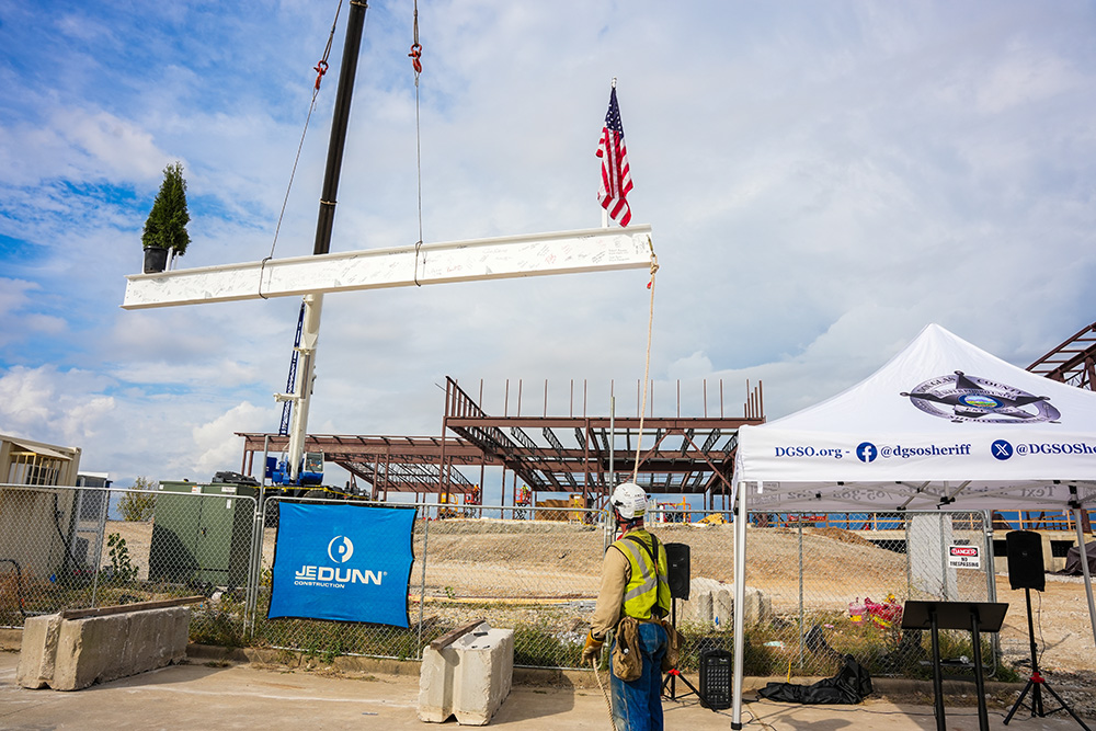 Crane lifting the steel beam