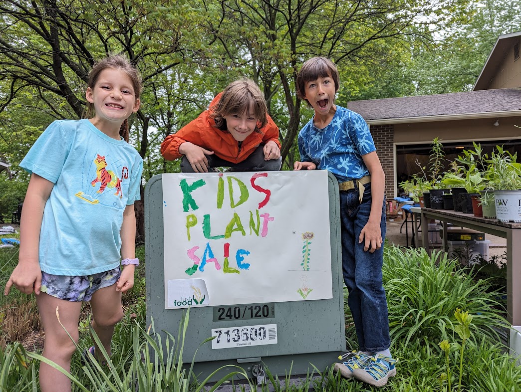 From left, Julia Lawson, and Sam and Elliott Harris are pictured in 2024. The idea for the plant sale started with Sam, and it has provided at least $13,500 in six years for Just Food.