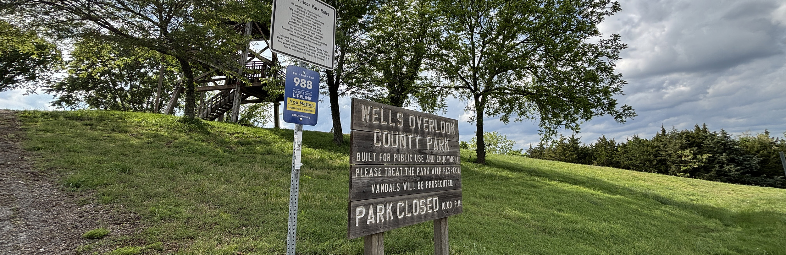 A new 988 Suicide & Crisis Lifeline sign at Wells Overlook Park