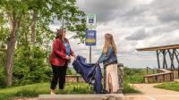 Community members reveal a new 988 sign at Wells Overlook Park
