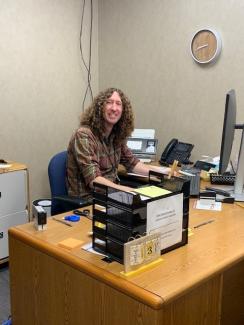 Leo sitting at desk in Baldwin City Treasurer's Office