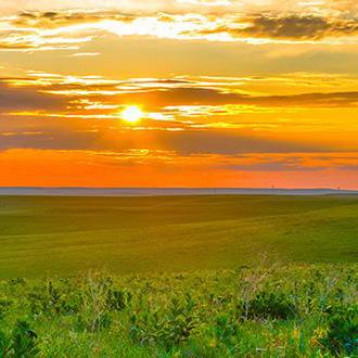 A nice sunset over a field
