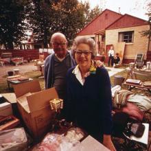 Senior couple clearing out a house