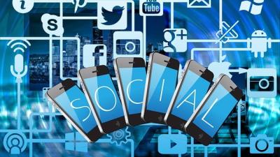 Blue matrix of social media icons and phones spelling social