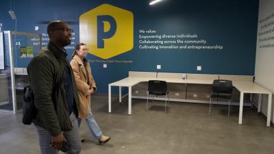 Michael Odupitan and Jessica Pauly, of Omni Circle, tour Peaslee Tech