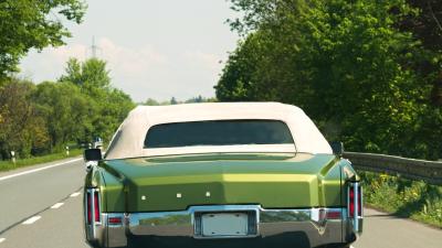 A retro green car - rear view